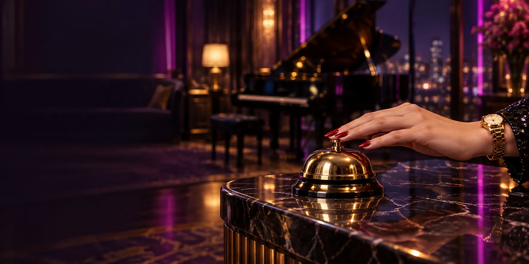 Close-up of a hand resting on a golden concierge bell in a mansion lounge